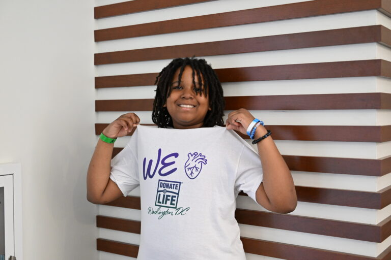 A young boy wears a Donate Life Washington, DC T-shirt to support organ, eye and tissue donation.