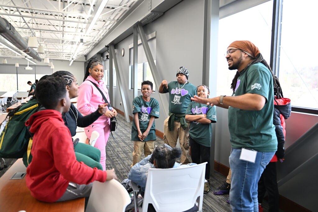 Young students stand in a circle after learning more about organ, eye and tissue donation at Infinite Legacy.